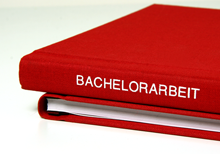 Bachelor thesis as a red hardcover book with embossing on linen